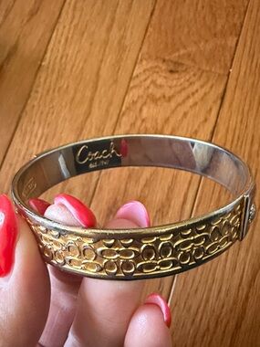 Coach Gold-Tone Signature Pattern Bangle Bracelet